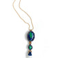 Far away view of: Handcrafted Azure Key Amulet from the You Are The Key Collection, featuring Malachite, Azurite, Clear Quartz, Lapis, and Gold filled silver. A symbol of enlightened leadership and insight. Adorned with a 1.5mm snake chain, 20 inches. Includes a custom silk bag for safekeeping. Experience the essence of the Azure Key—a unique blend of gemstones for personal transformation.