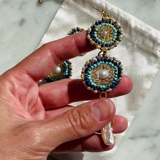 A video of detailed beadwork for Water Key Gemstone Earrings from the You Are The Key Collection - Handcrafted with care, featuring gemstones such as Turquoise, Labradorite, and Pearl for personal transformation. A cool, calming touch with a sense of freshness. Each piece includes a custom silk bag, guided meditation, and instruction video. 