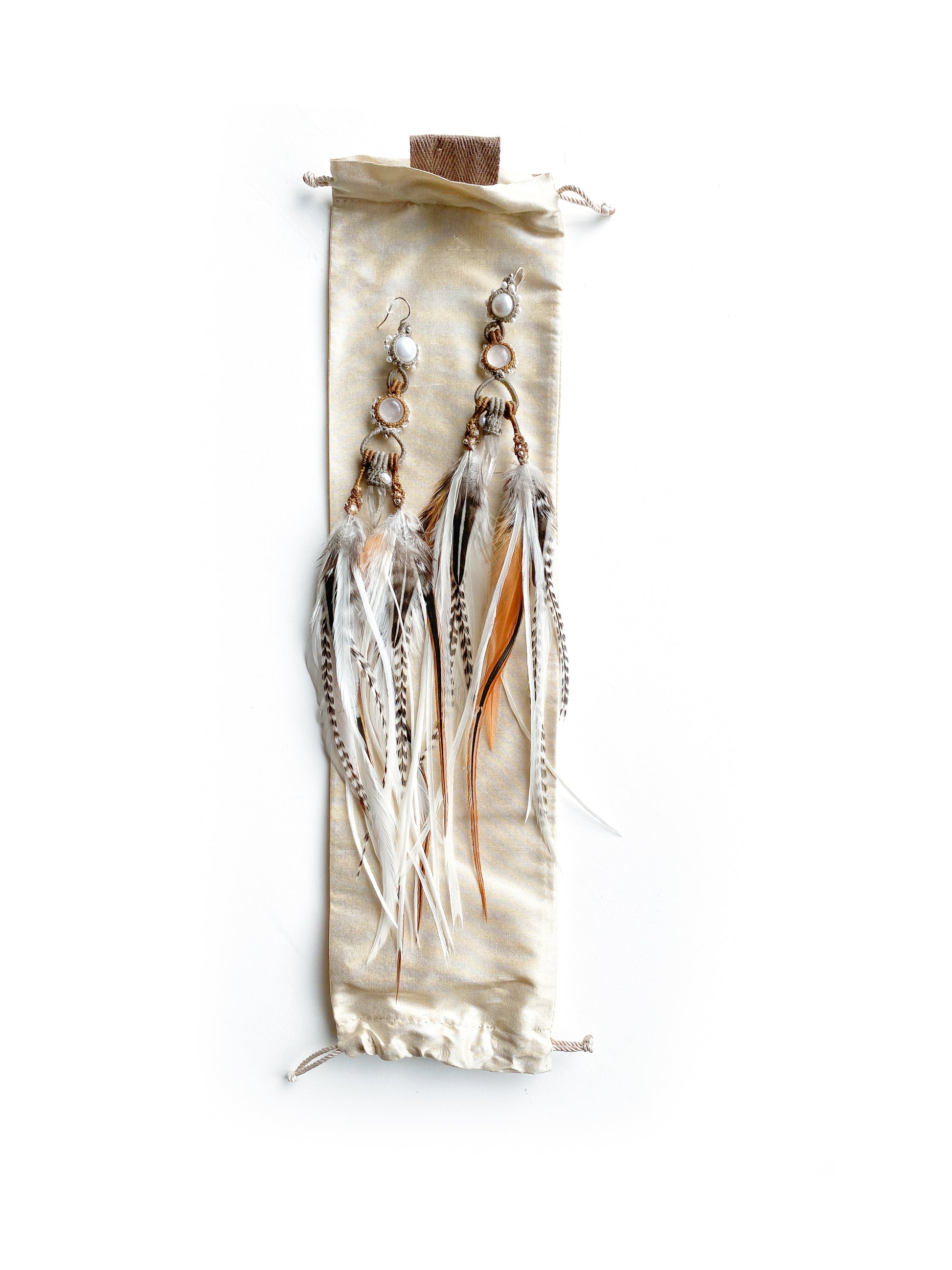 Feather Earrings with handmade silk bag: Craftsmanship showcased in every detail, a masterpiece of love and intention.