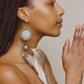 Side view of model wearing Feather Earrings – gemstones and precious metals, a masterpiece of love and intricate knots